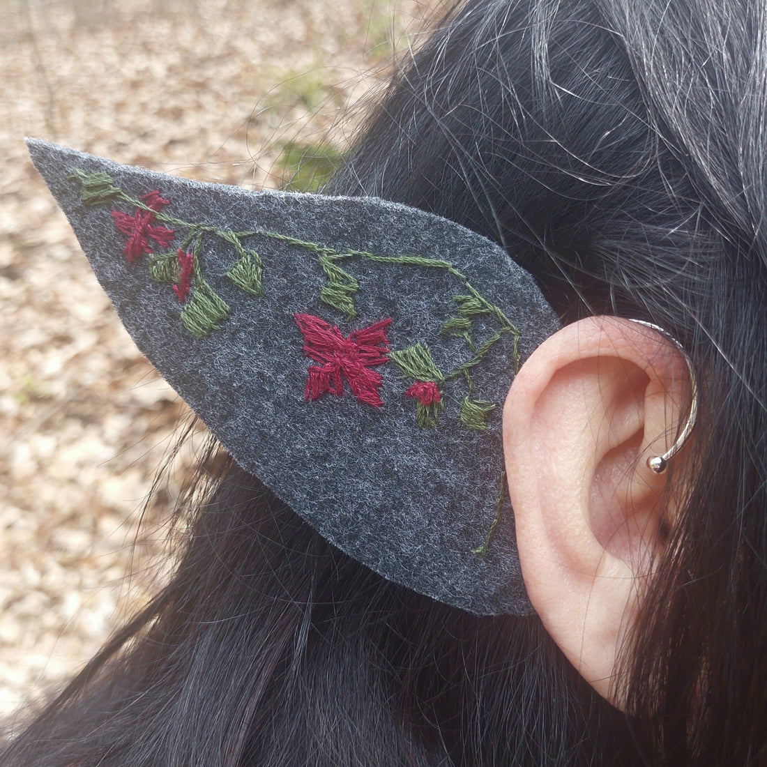Handmade felt elf ear cuff with hand-embroidered dark flower, worn on the ear without piercing – dark fantasy cosplay gift for her