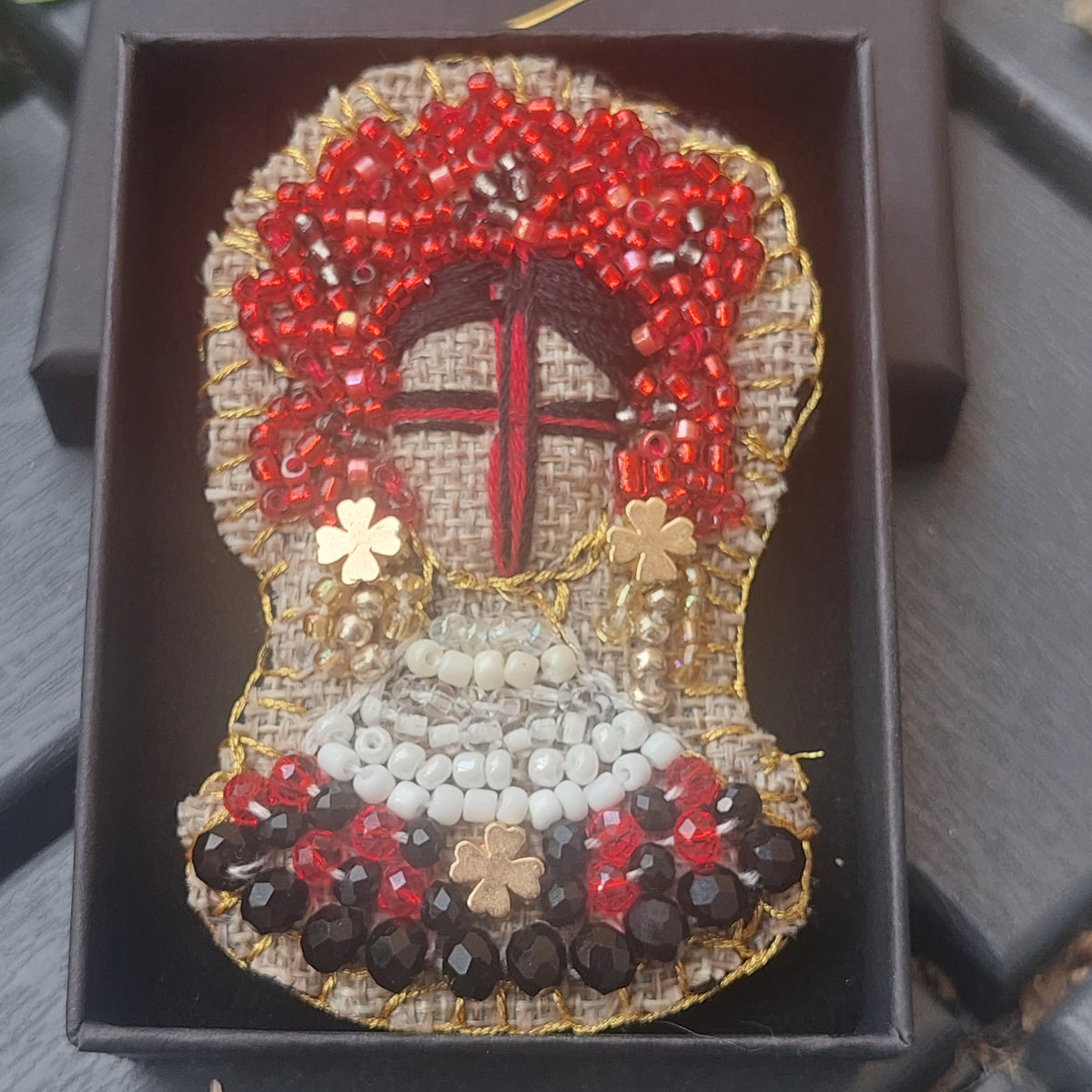 Detailed beadwork and embroidery on a handmade Ukrainian textile brooch
