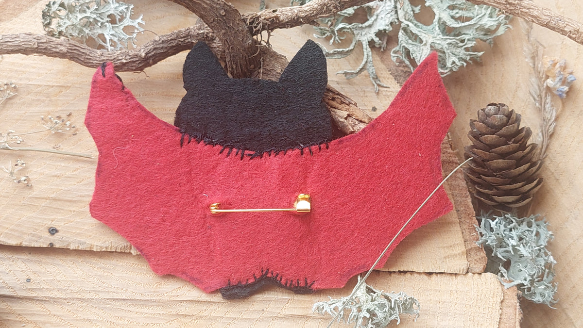 lose-up of hand-embroidered vampire bat felt brooch 