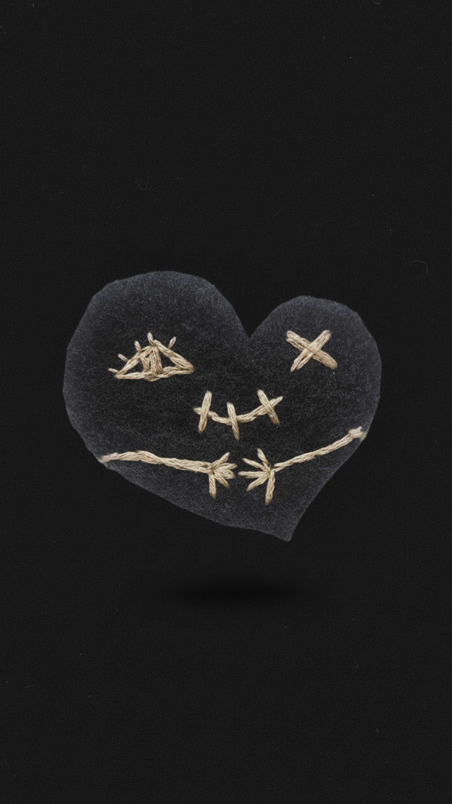 Dark gothic phone wallpapers featuring a stitched heart inspired by stoic philosophy and Marcus Aurelius. 
