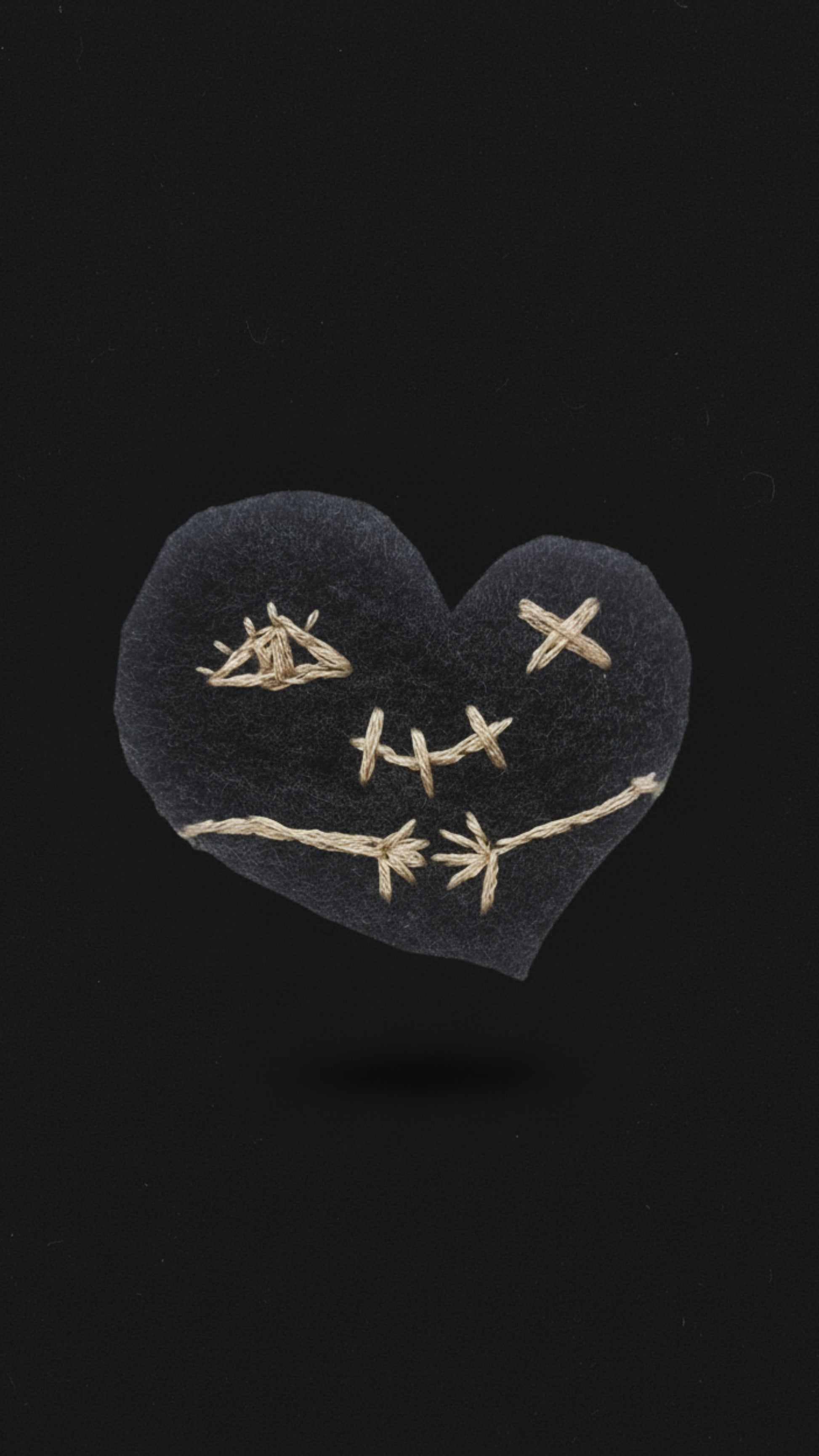 Dark gothic phone wallpapers featuring a stitched heart inspired by stoic philosophy and Marcus Aurelius. 
