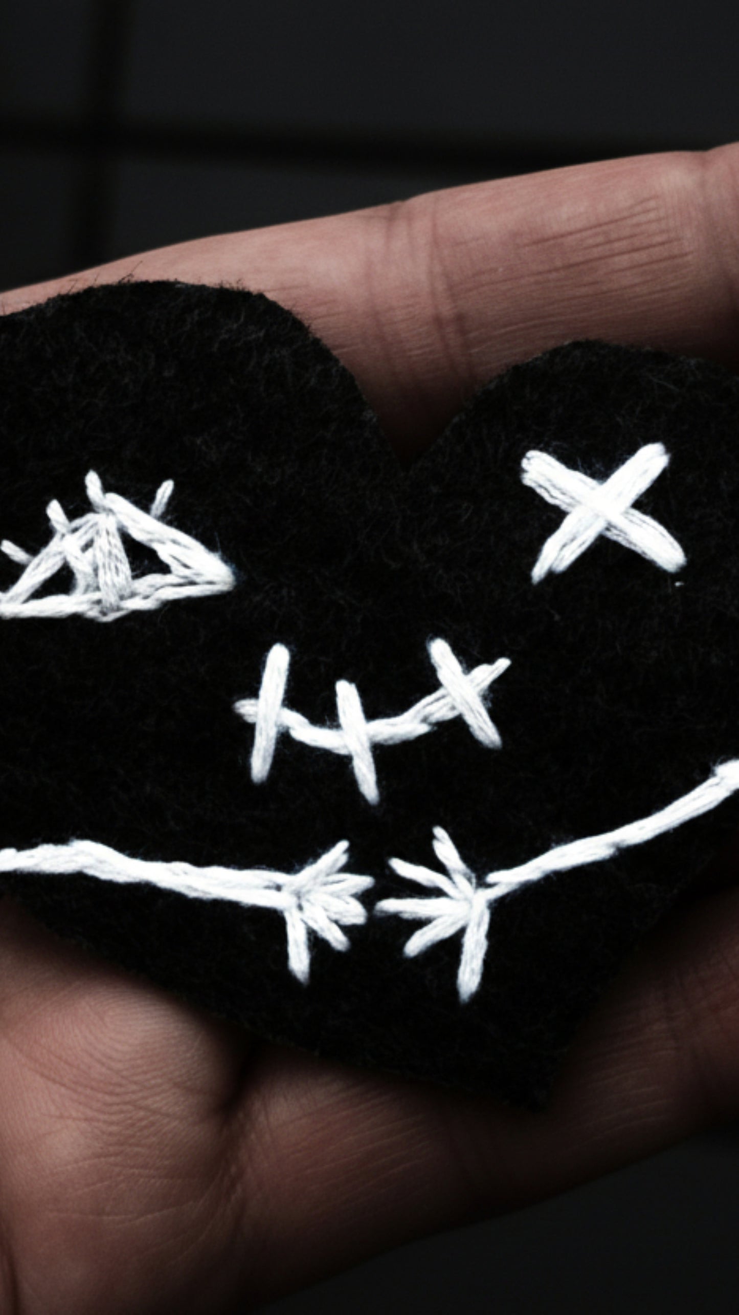 Dark gothic phone wallpapers featuring a stitched heart 