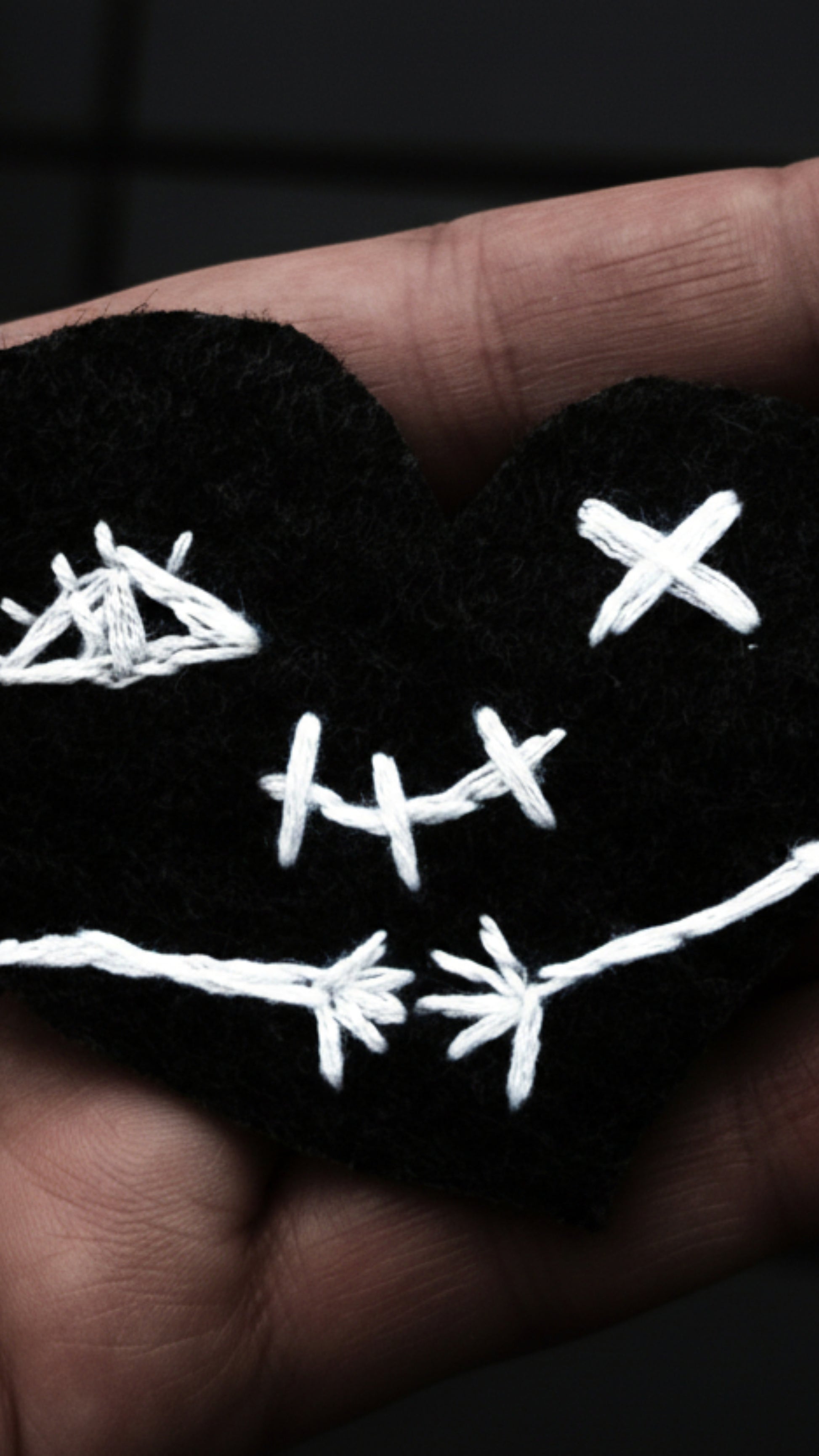 Dark gothic phone wallpapers featuring a stitched heart 