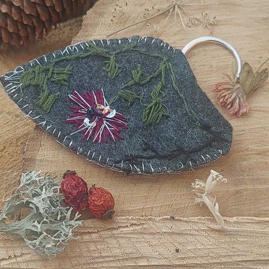 Hand-embroidered elf ear cuffs inspired by dark fantasy and forest botanics.