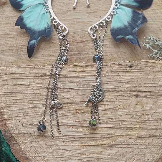 Dark fantasy moon moth ear cuff video - showing movement of chains and wings
